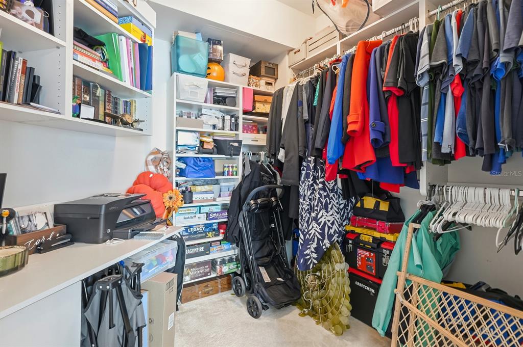 231 Riverside Drive, Unit 1702 Holly Hill, FL 32117 - Photo 29 of 74 a view of walk in closet with clothes and shoes