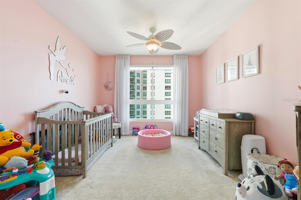 231 Riverside Drive, Unit 1702 Holly Hill, FL 32117 - Photo 30 of 74 a bedroom with a bed and a window