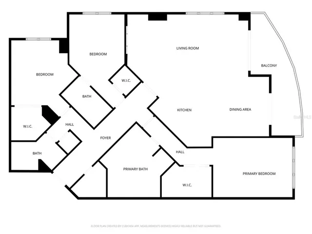 a view of a hallway with wooden floor and a living room