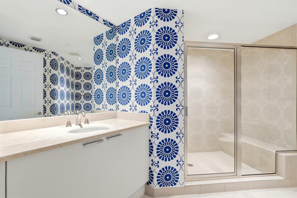 231 Riverside Drive, Unit 1702 Holly Hill, FL 32117 - Photo 34 of 74 a bathroom with a sink and a mirror