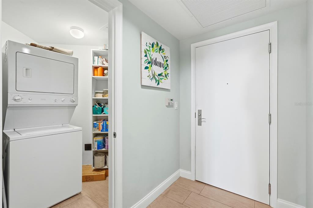 231 Riverside Drive, Unit 1702 Holly Hill, FL 32117 - Photo 35 of 74 a view of storage and utility room with washer and dryer