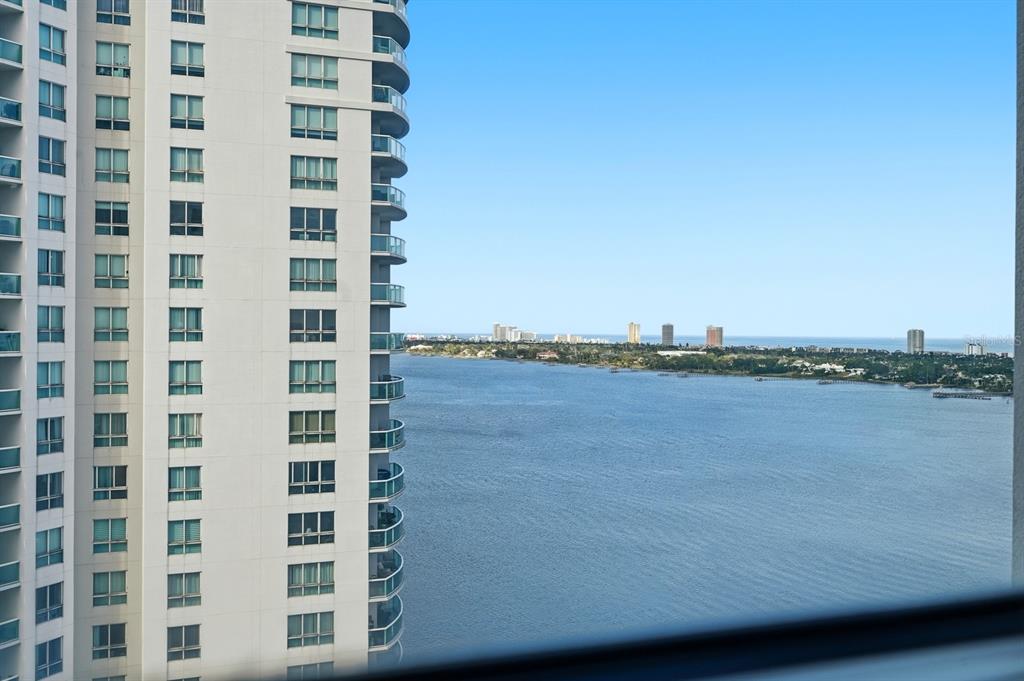 231 Riverside Drive, Unit 1702 Holly Hill, FL 32117 - Photo 37 of 74 a view of a lake with building in front of it