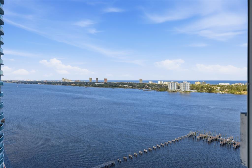 231 Riverside Drive, Unit 1702 Holly Hill, FL 32117 - Photo 46 of 74 a view of a lake and tall trees