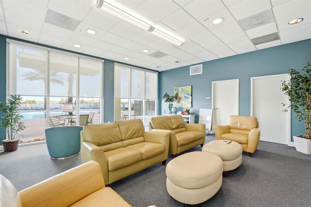 231 Riverside Drive, Unit 1702 Holly Hill, FL 32117 - Photo 49 of 74 a living room with furniture and a large window