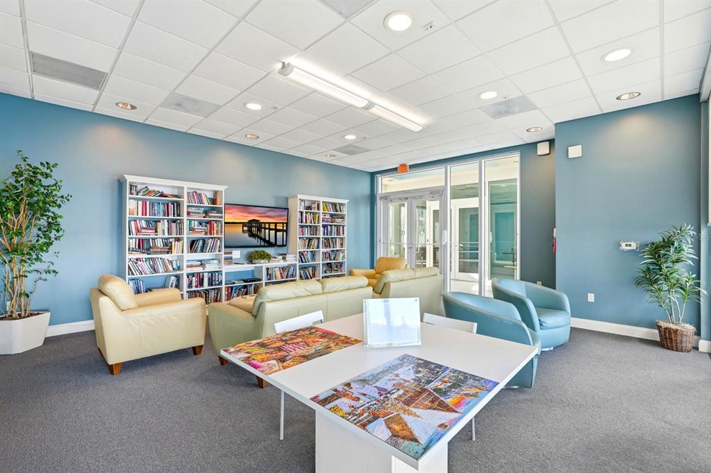 231 Riverside Drive, Unit 1702 Holly Hill, FL 32117 - Photo 50 of 74 a living room with fireplace furniture and a potted plant