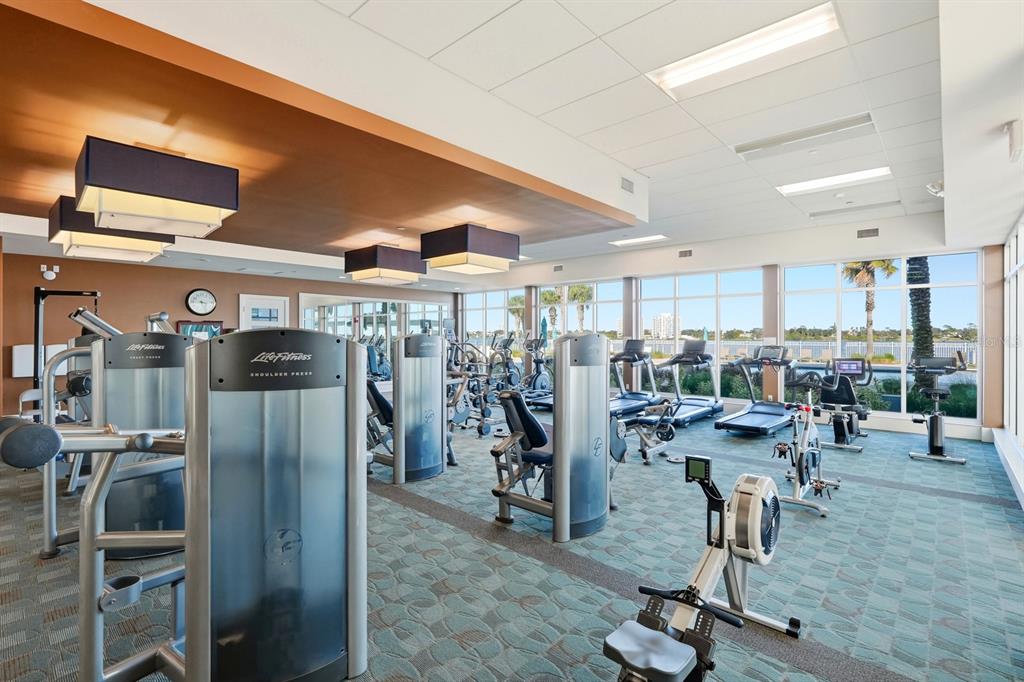 231 Riverside Drive, Unit 1702 Holly Hill, FL 32117 - Photo 56 of 74 a view of a room with gym equipment