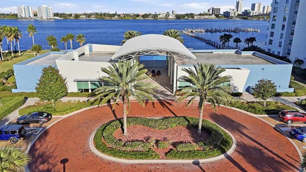 231 Riverside Drive, Unit 1702 Holly Hill, FL 32117 - Photo 69 of 74 a view of a swimming pool with a patio and a garden