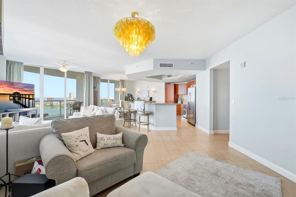 231 Riverside Drive, Unit 1702 Holly Hill, FL 32117 - Photo 9 of 74 a living room with furniture and a table
