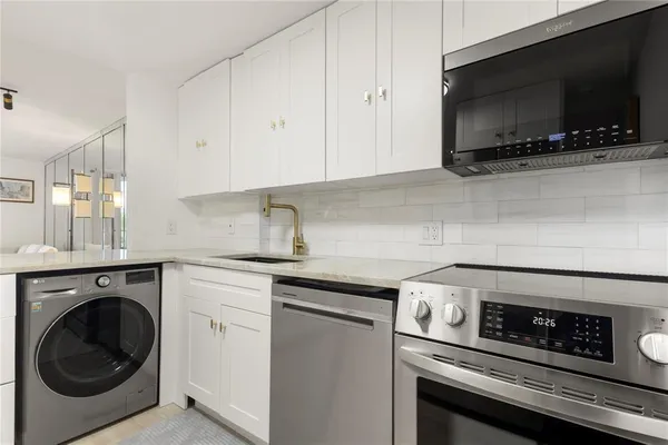 a kitchen with a stove and a microwave
