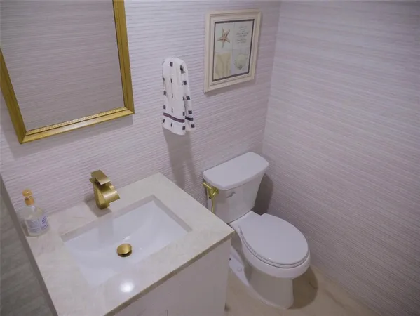 a bathroom with a sink and a toilet
