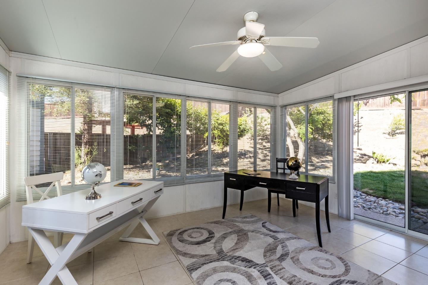 2372 Dubois Street Milpitas, CA 95035 - Photo 11 of 30 a living room with furniture a table and a large window