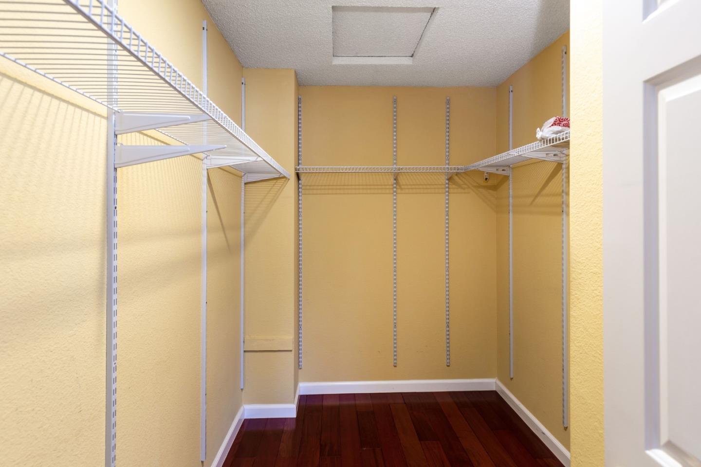 2372 Dubois Street Milpitas, CA 95035 - Photo 15 of 30 a view of walk in closet with wooden floor
