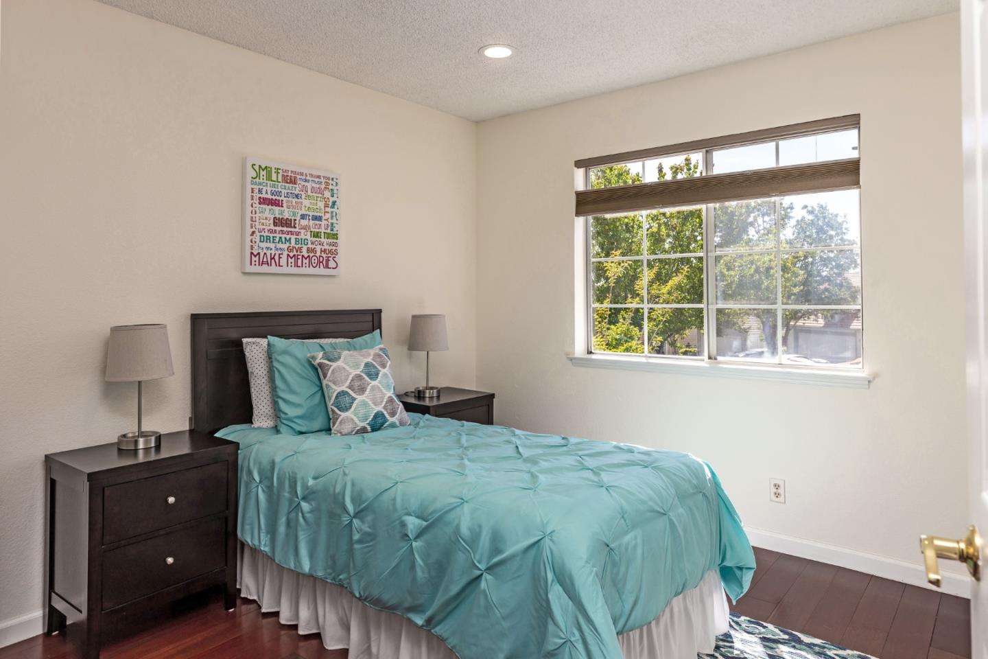 2372 Dubois Street Milpitas, CA 95035 - Photo 17 of 30 a bedroom with a bed and a window