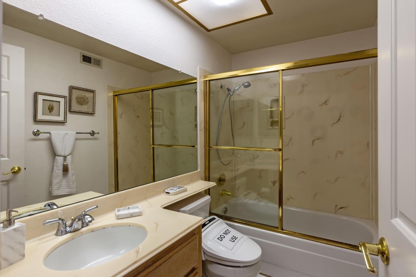 2372 Dubois Street Milpitas, CA 95035 - Photo 19 of 30 a bathroom with a sink toilet and shower