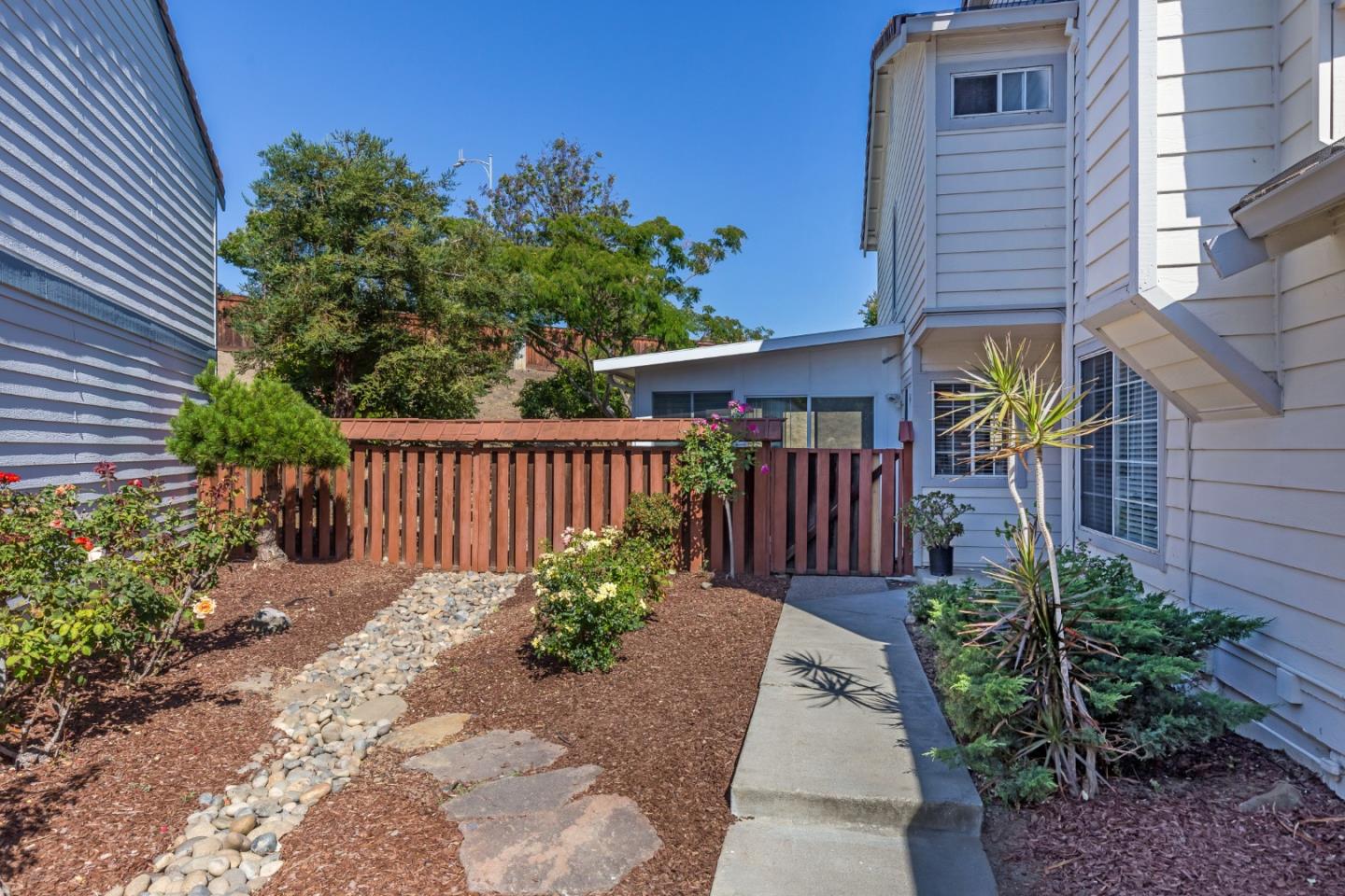 2372 Dubois Street Milpitas, CA 95035 - Photo 3 of 30 a view of a garden with pathway