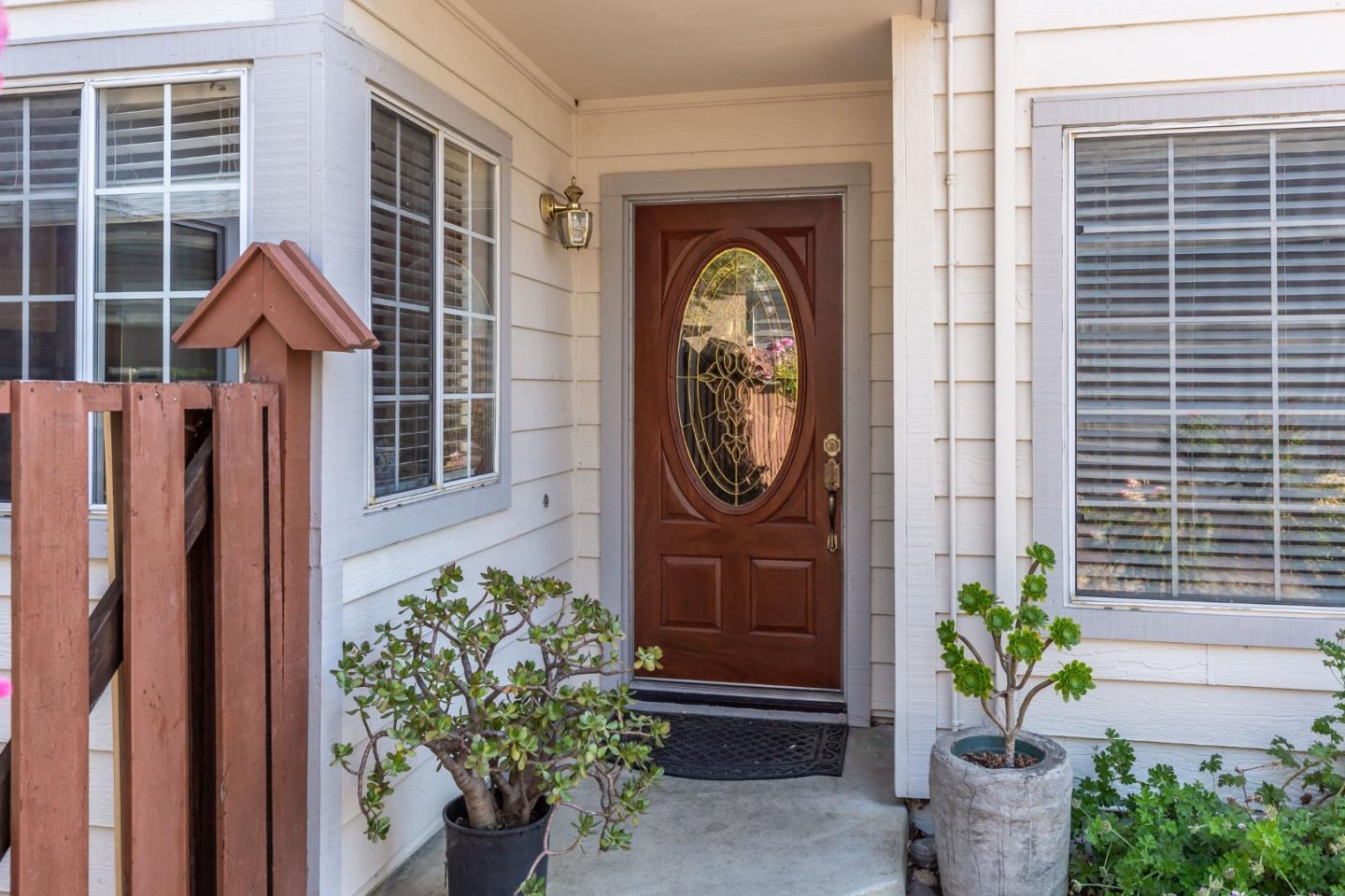 2372 Dubois Street Milpitas, CA 95035 - Photo 4 of 30 a front view of a house with potted plants
