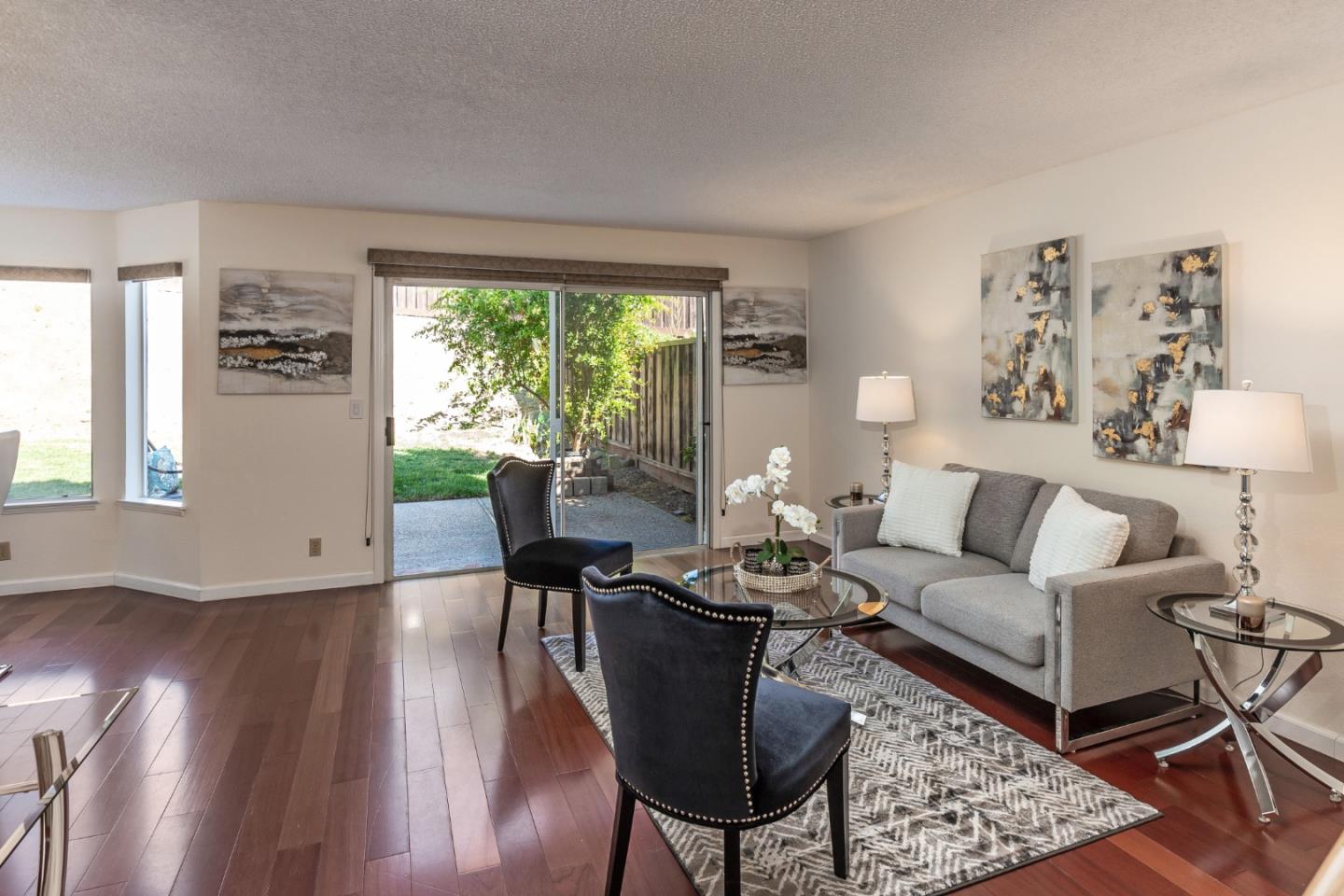 2372 Dubois Street Milpitas, CA 95035 - Photo 6 of 30 a living room with furniture and a large window