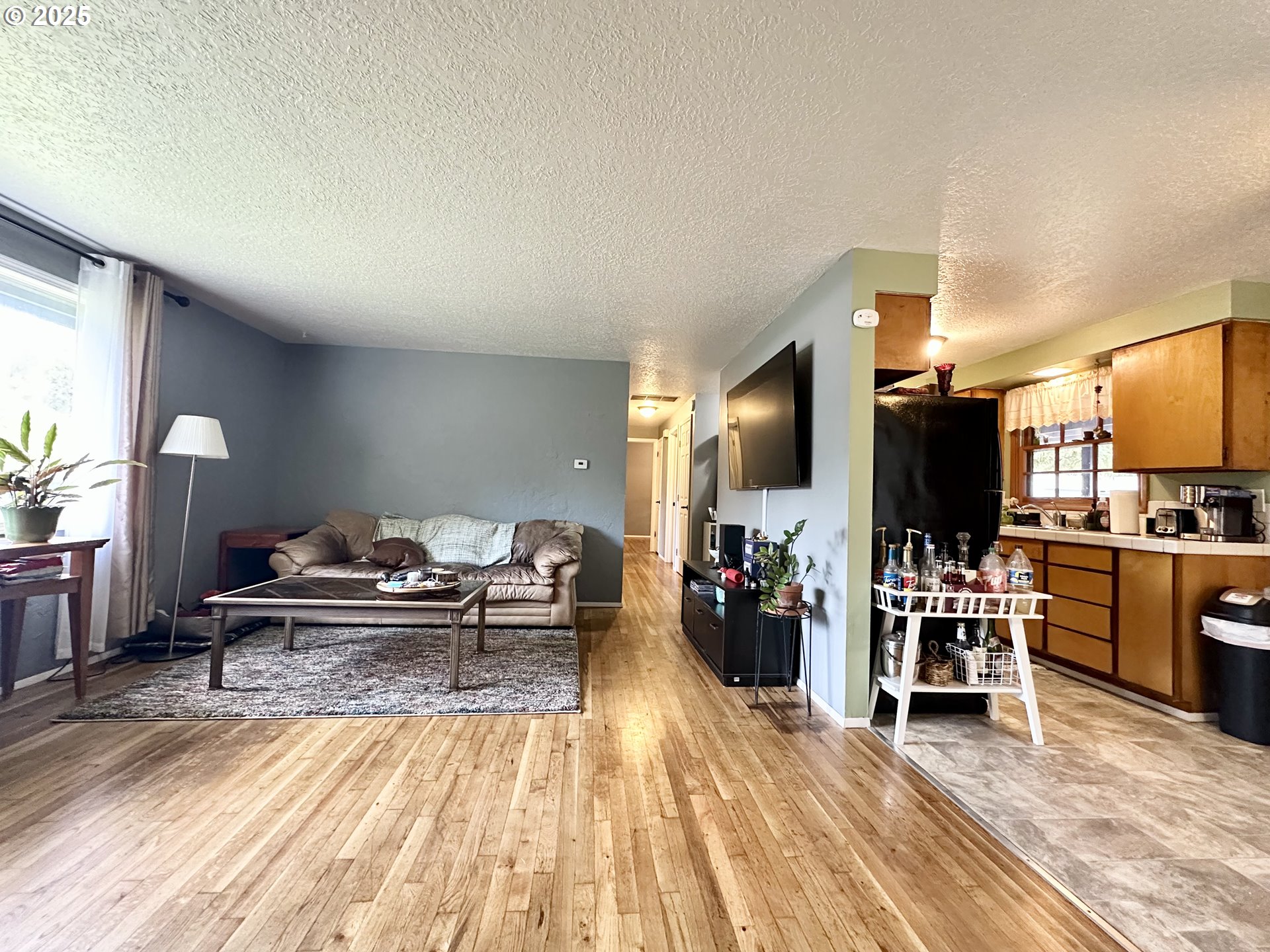 1563 Southeast 11th Street Gresham, OR 97080 - Photo 13 of 30 a living room with furniture and flat screen tv