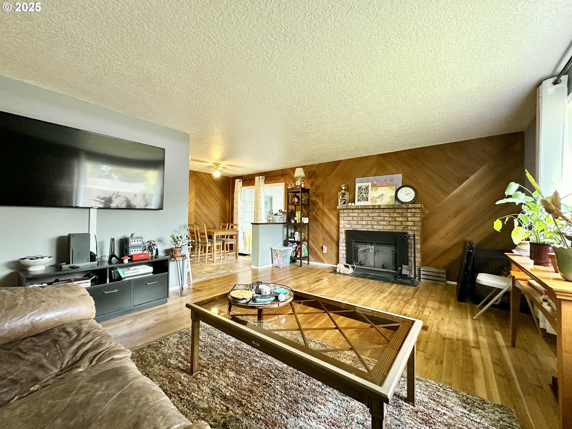 1563 Southeast 11th Street Gresham, OR 97080 - Photo 15 of 30 a living room with furniture and a fireplace
