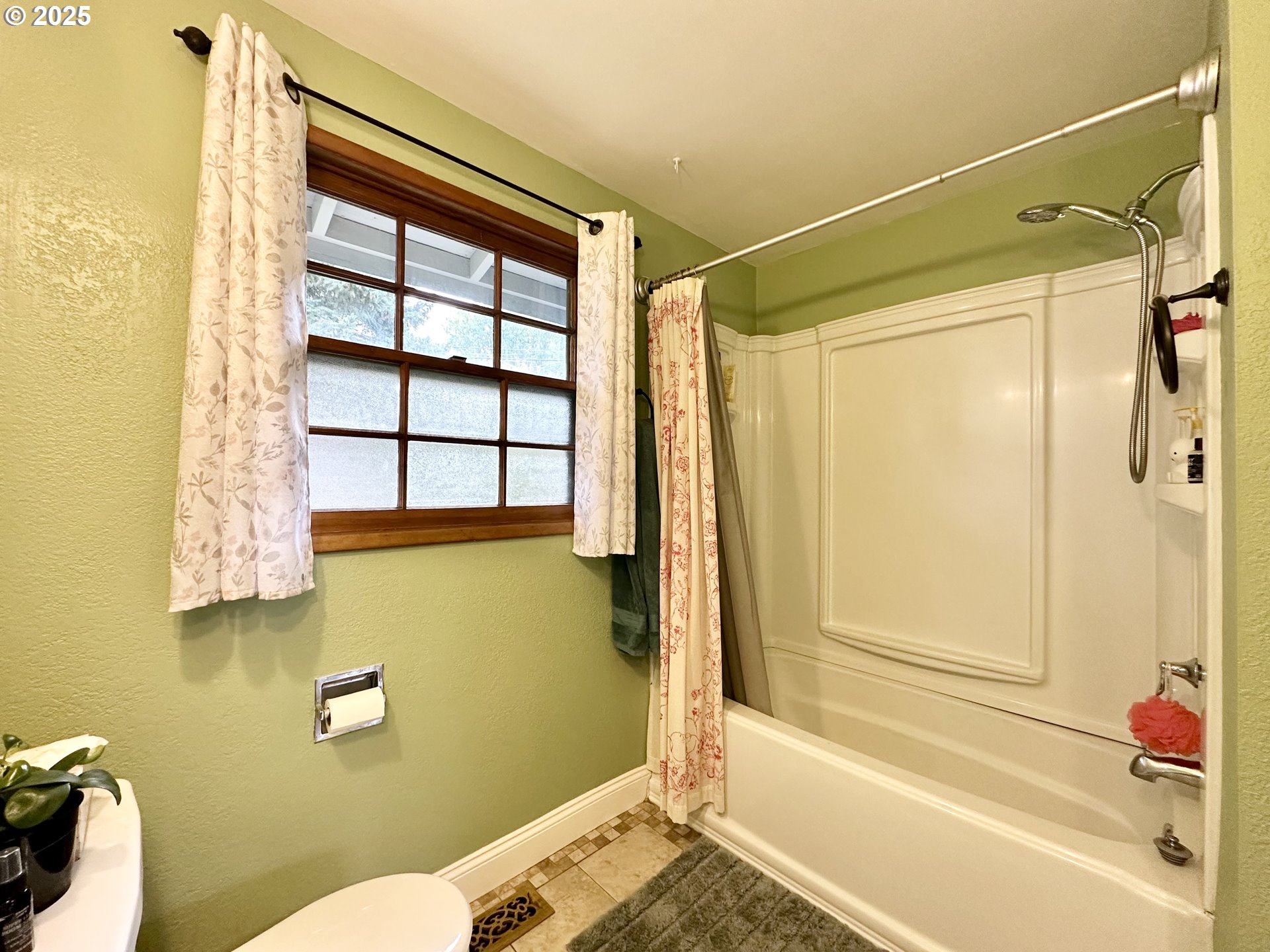 1563 Southeast 11th Street Gresham, OR 97080 - Photo 19 of 30 a bathroom with a sink toilet and shower