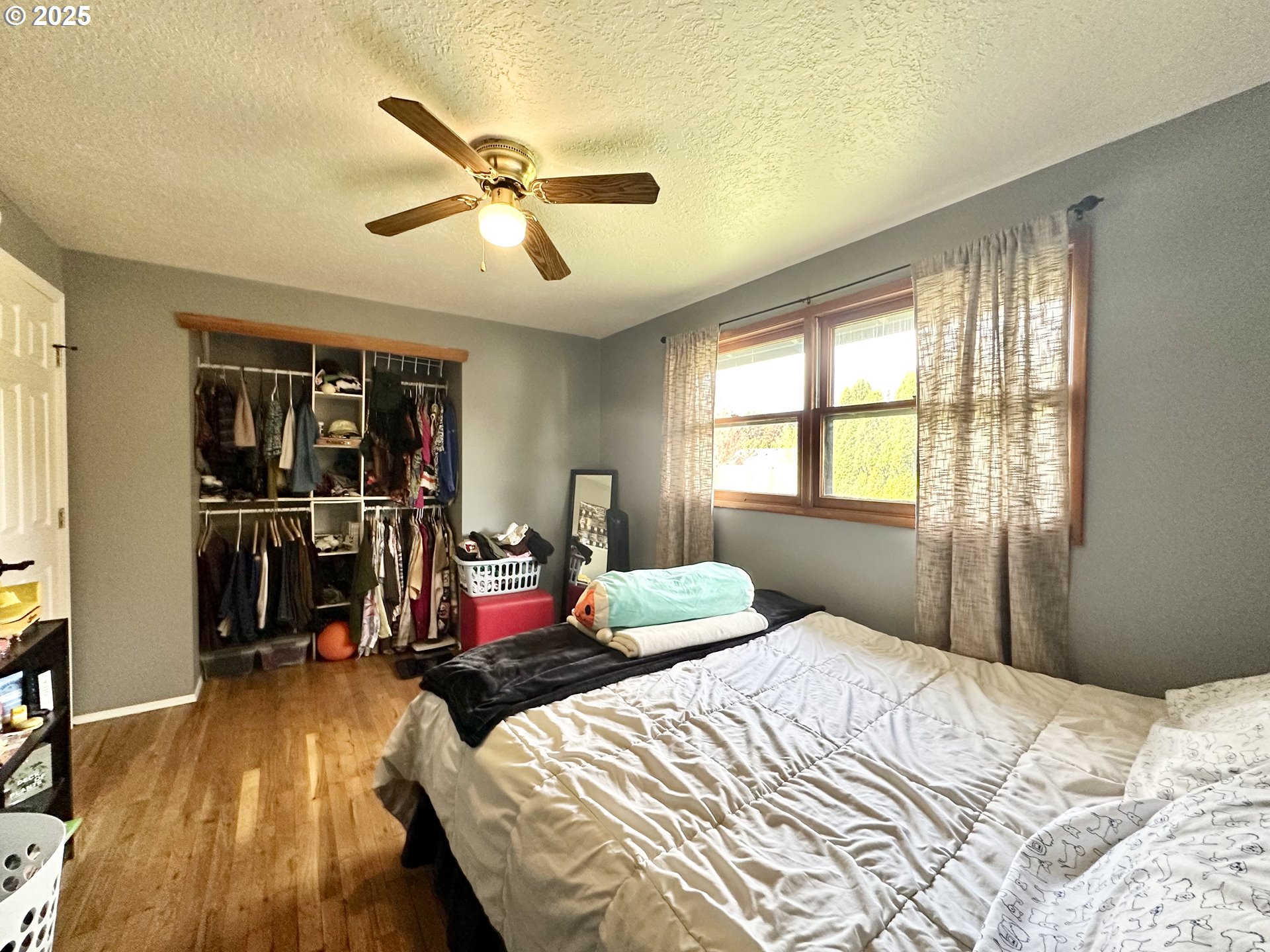 1563 Southeast 11th Street Gresham, OR 97080 - Photo 22 of 30 a bedroom with a bed and a window