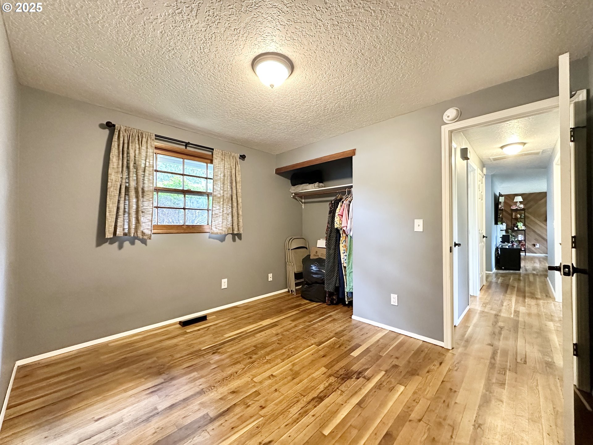 1563 Southeast 11th Street Gresham, OR 97080 - Photo 24 of 30 a view of a room with wooden floor