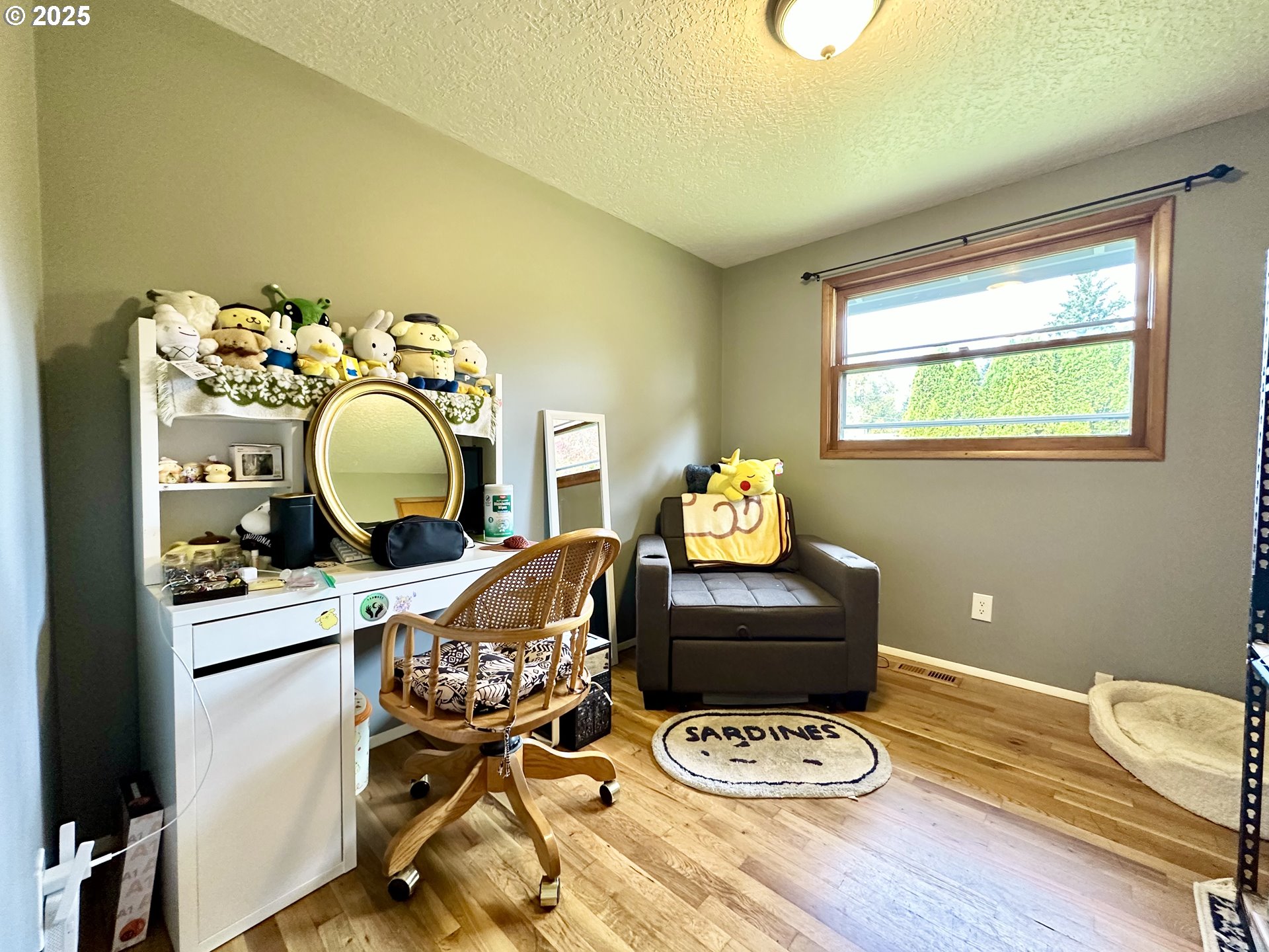 1563 Southeast 11th Street Gresham, OR 97080 - Photo 25 of 30 a living room with furniture and a wooden floor