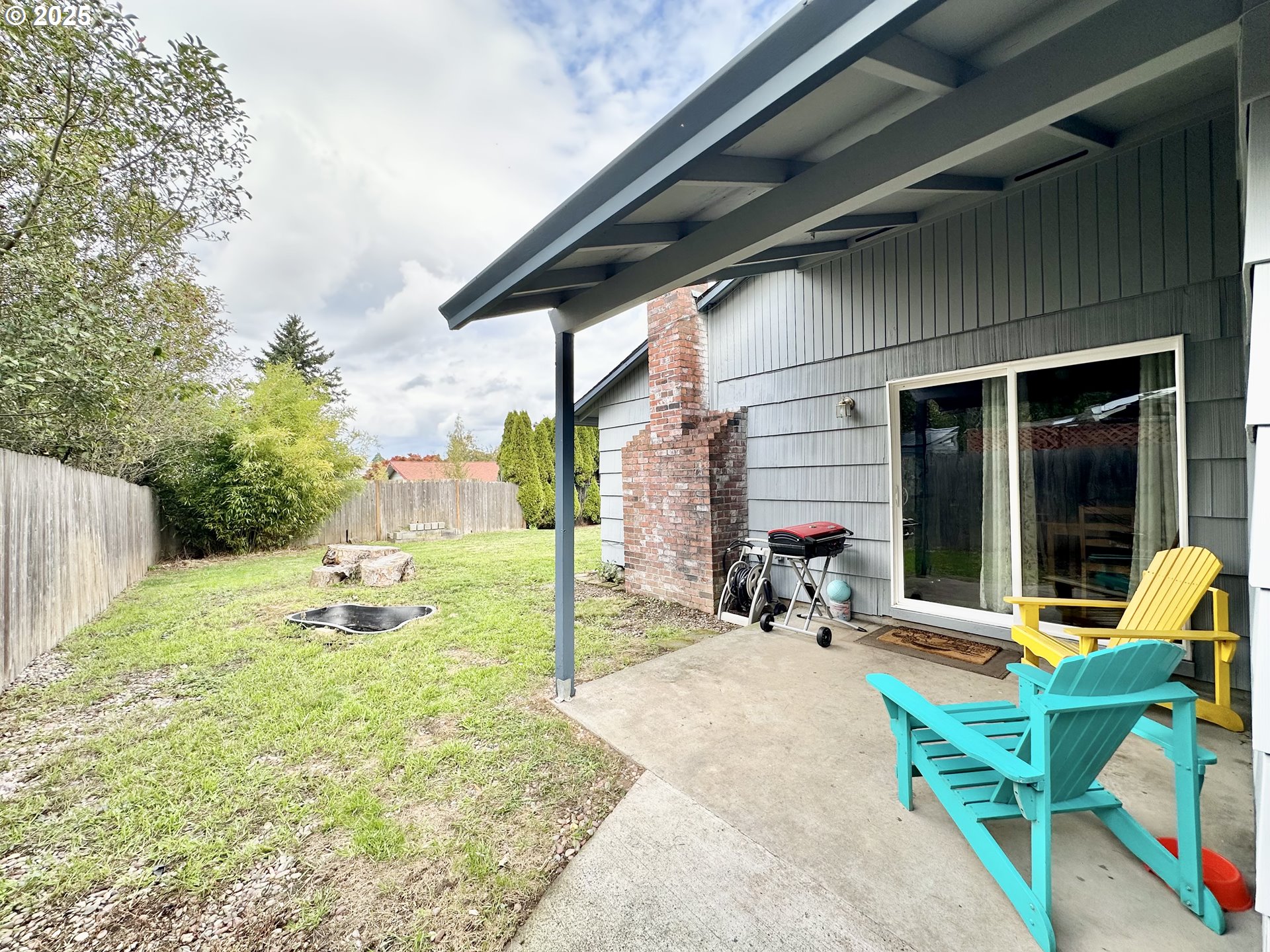 1563 Southeast 11th Street Gresham, OR 97080 - Photo 29 of 30 a view of a chair and tables in patio of the house