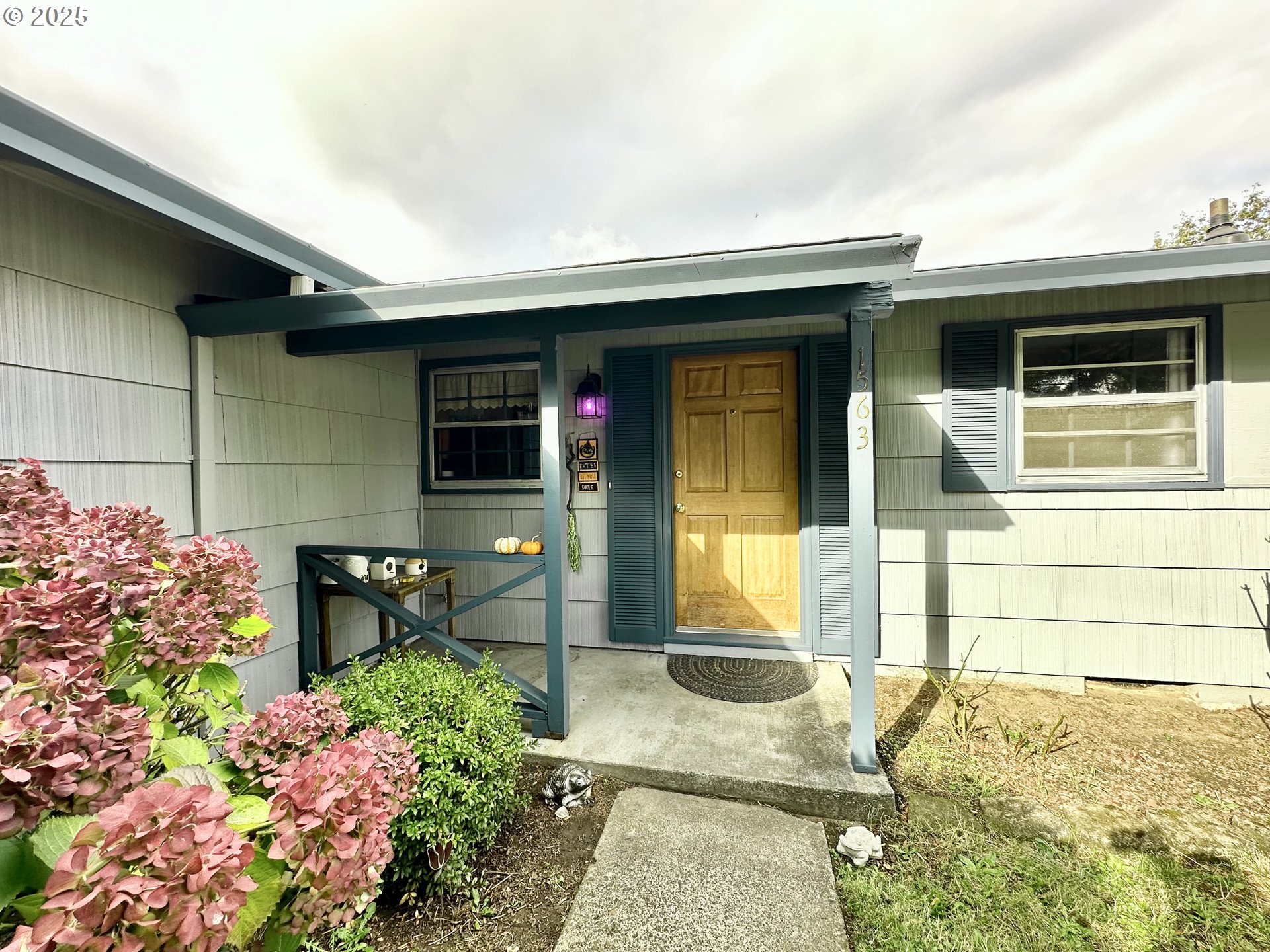 1563 Southeast 11th Street Gresham, OR 97080 - Photo 4 of 30 a front view of a house with a porch