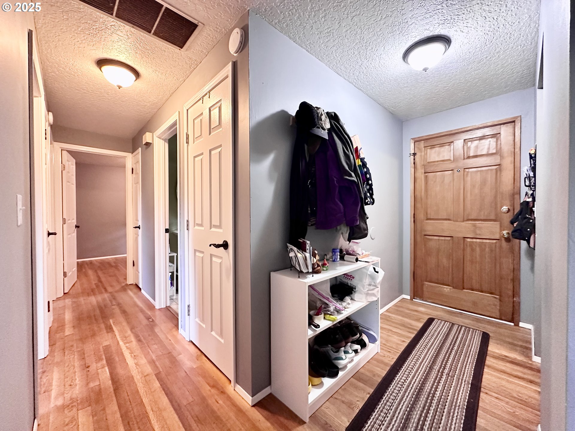 1563 Southeast 11th Street Gresham, OR 97080 - Photo 5 of 30 a view of walk in closet with clothes and shoes