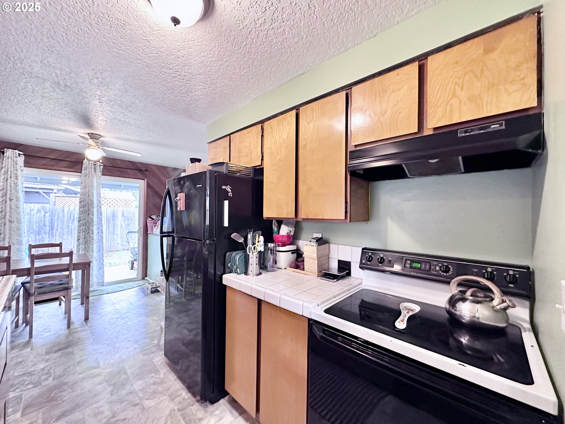 1563 Southeast 11th Street Gresham, OR 97080 - Photo 7 of 30 a kitchen with a stove a sink and cabinets