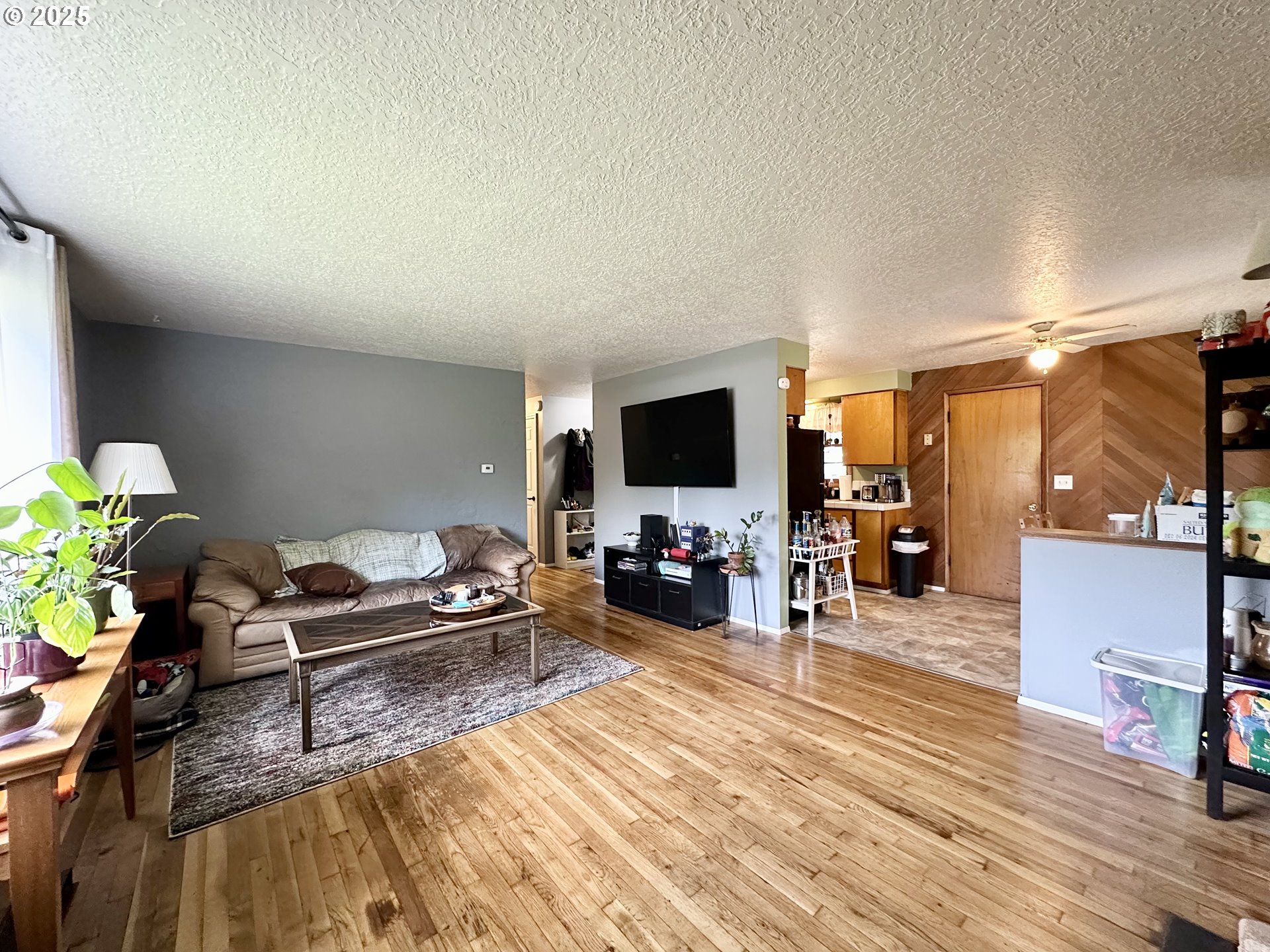 1563 Southeast 11th Street Gresham, OR 97080 - Photo 10 of 30 a living room with furniture and a flat screen tv