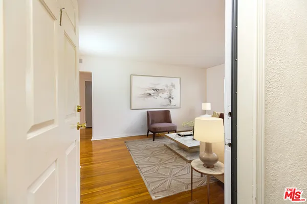 a living room with furniture and a rug