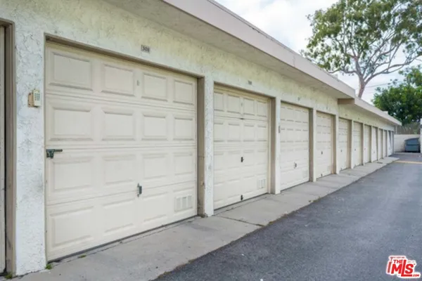 a view of a street with houses on both side of it