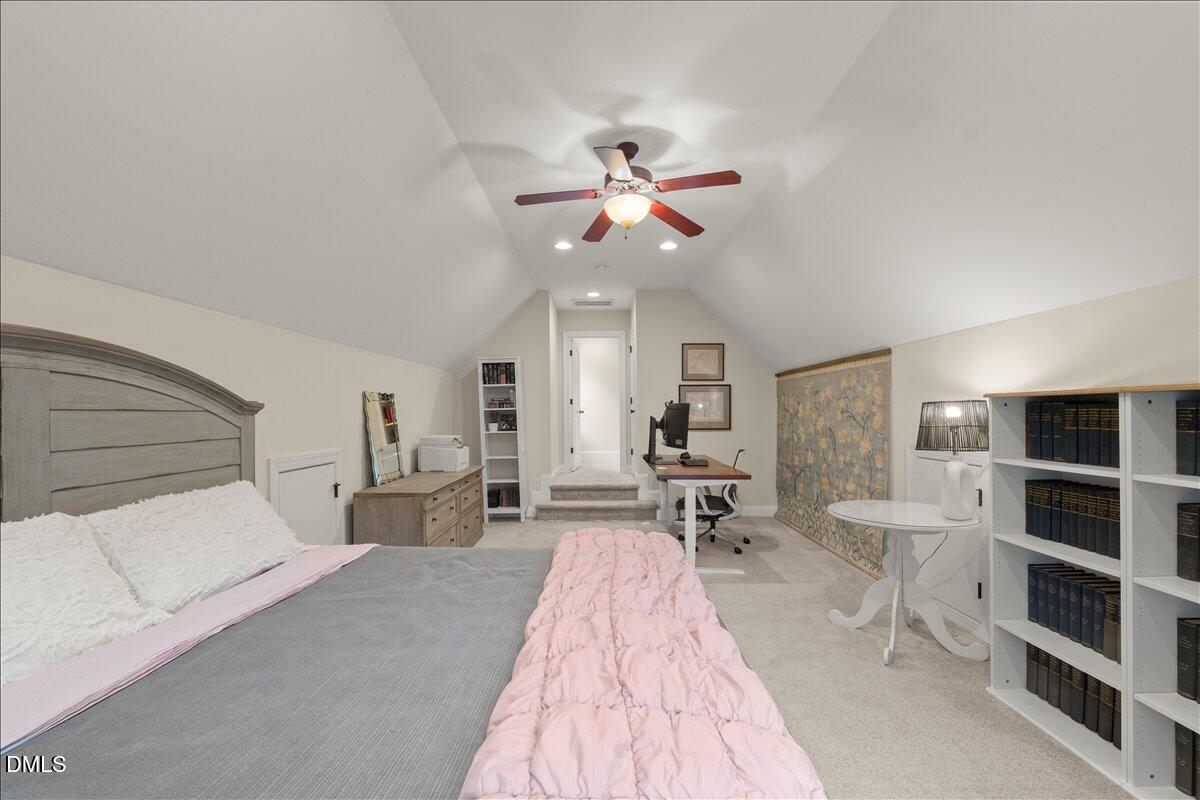 7400 Denlee Road Raleigh, NC 27603 - Photo 26 of 47 a bed room with a bed and a chair
