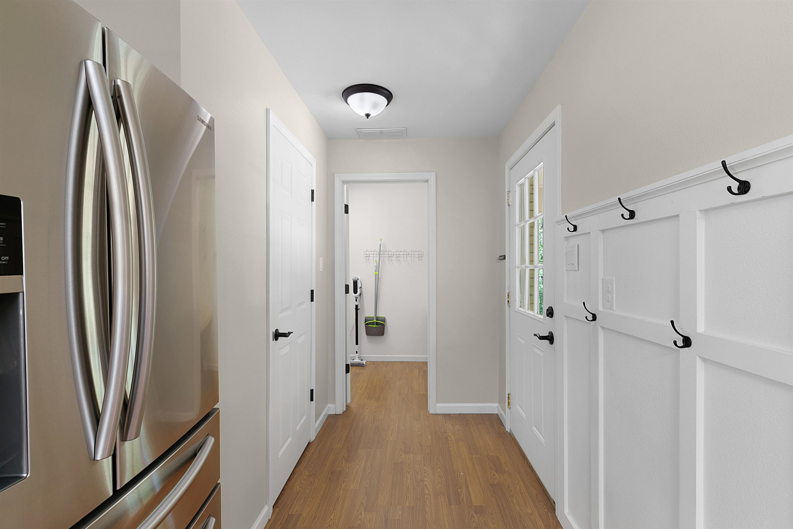 816 Bascom Road Jackson, TN 38305 - Photo 8 of 20 a view of hallway with stainless steel appliances a refrigerator