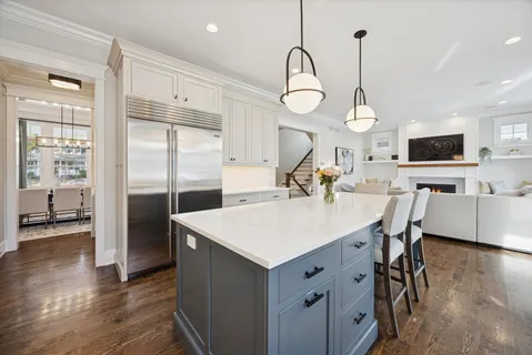 a view of dining room and kitchen with wooden floor