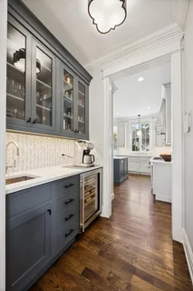 a bathroom with a sink mirror vanity and toilet