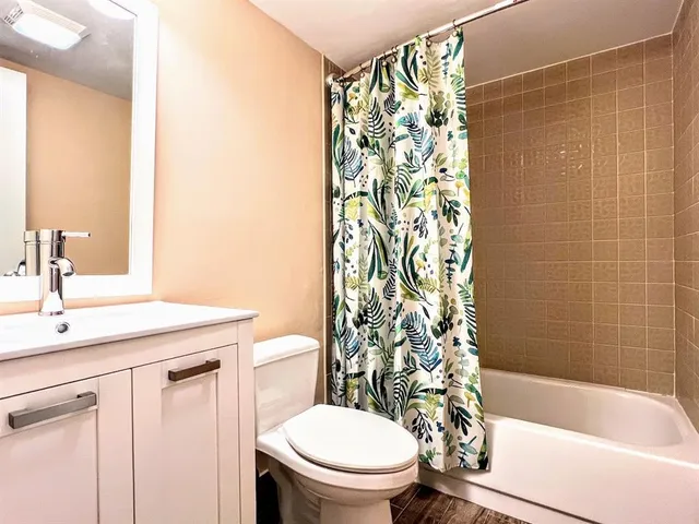 a bathroom with a sink a toilet and a bathtub