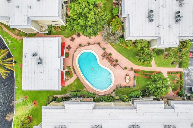 an aerial view of a house with a swimming pool