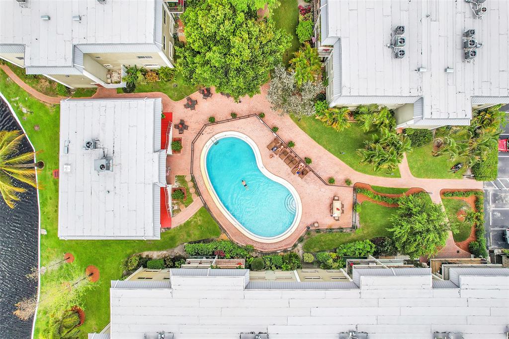 3002 Northeast 5th Terrace, Unit 102B Wilton Manors, FL 33334 - Photo 38 of 44 an aerial view of a house with a swimming pool