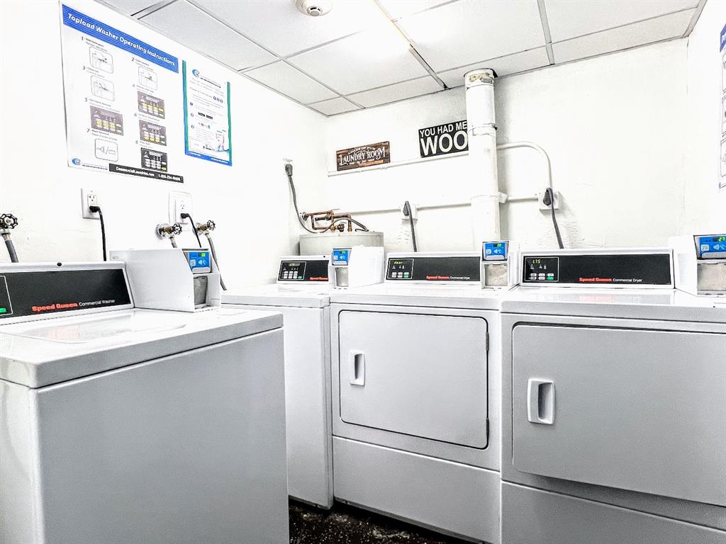 3002 Northeast 5th Terrace, Unit 102B Wilton Manors, FL 33334 - Photo 40 of 44 a utility room with dryer and washer