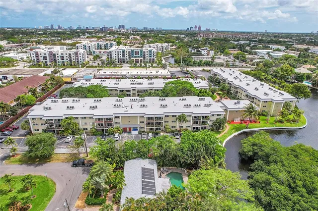 an aerial view of residential houses with outdoor space