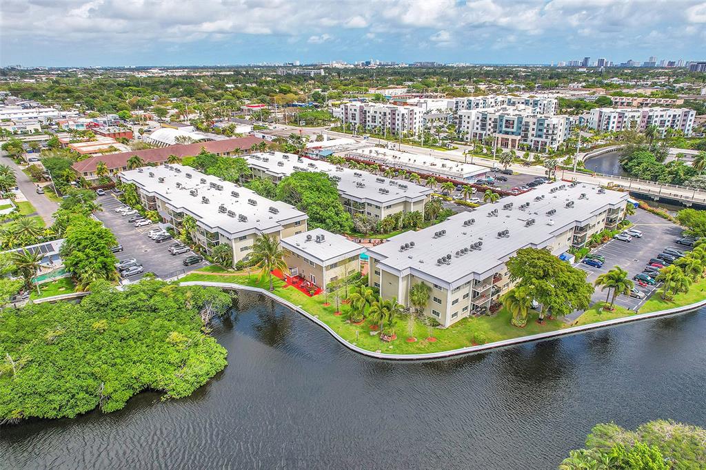 3002 Northeast 5th Terrace, Unit 102B Wilton Manors, FL 33334 - Photo 43 of 44 an aerial view of residential houses with outdoor space