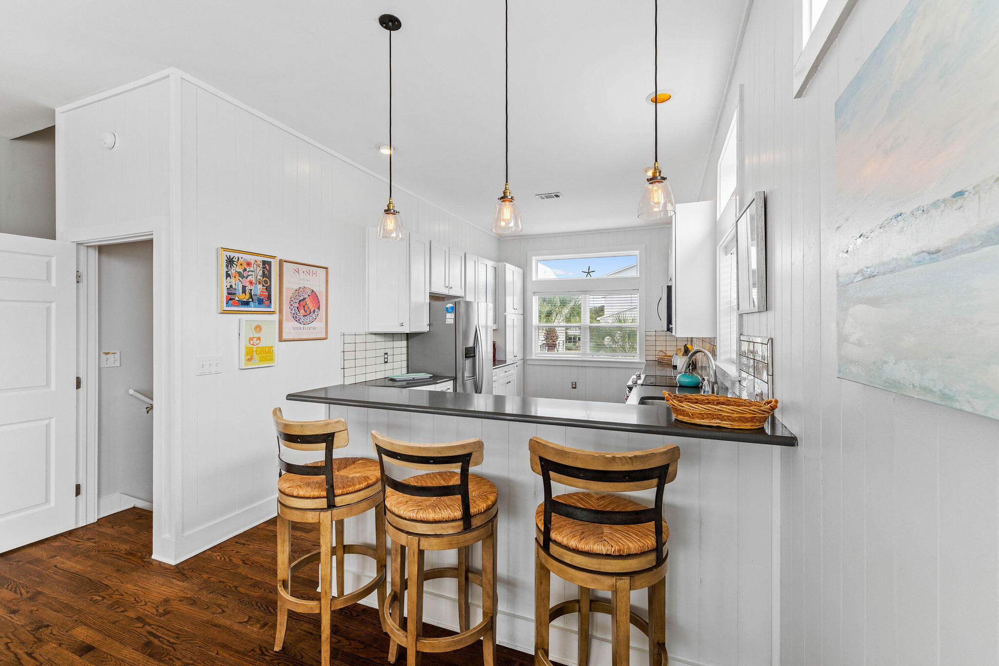 49 Sandy Lane Santa Rosa Beach, FL 32459 - Photo 11 of 73 a kitchen with a sink and chairs
