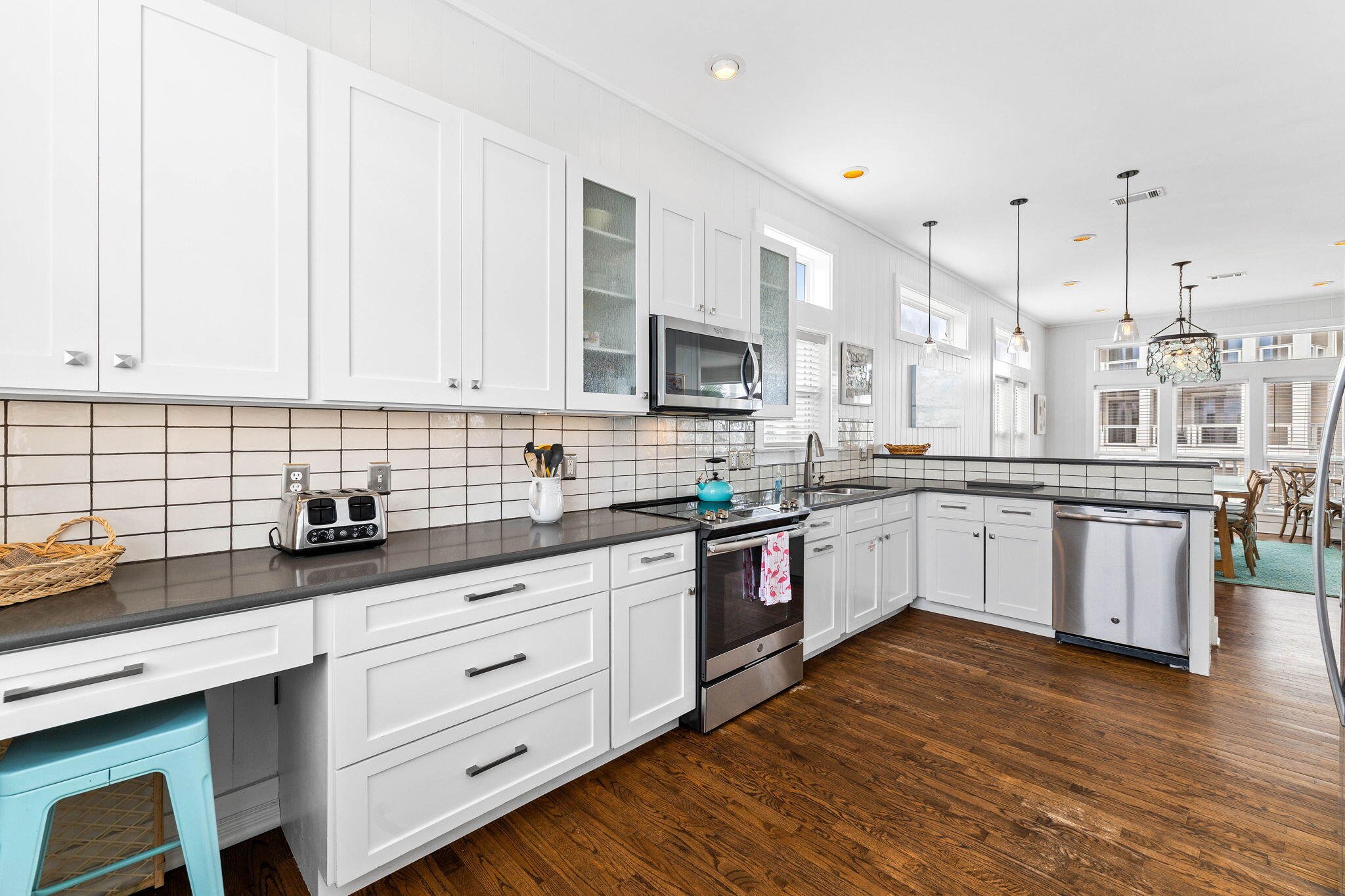 49 Sandy Lane Santa Rosa Beach, FL 32459 - Photo 14 of 73 a large kitchen with stainless steel appliances granite countertop a lot of counter space and wooden floors