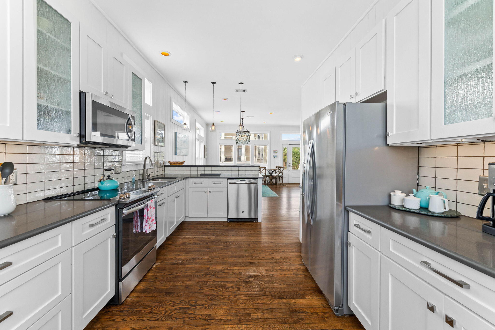 49 Sandy Lane Santa Rosa Beach, FL 32459 - Photo 15 of 73 a kitchen with stainless steel appliances a refrigerator sink and cabinets