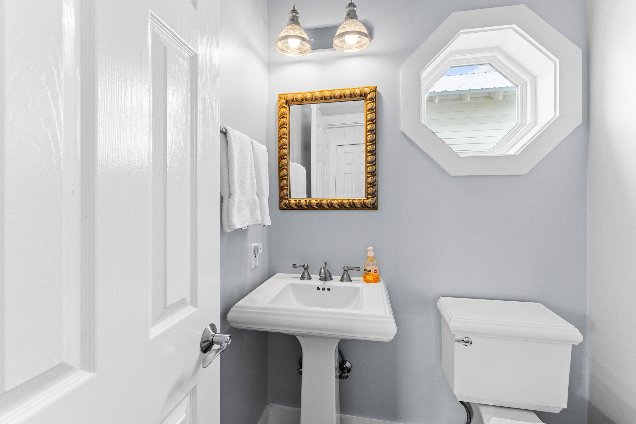 49 Sandy Lane Santa Rosa Beach, FL 32459 - Photo 20 of 73 a bathroom with a sink a mirror and a toilet