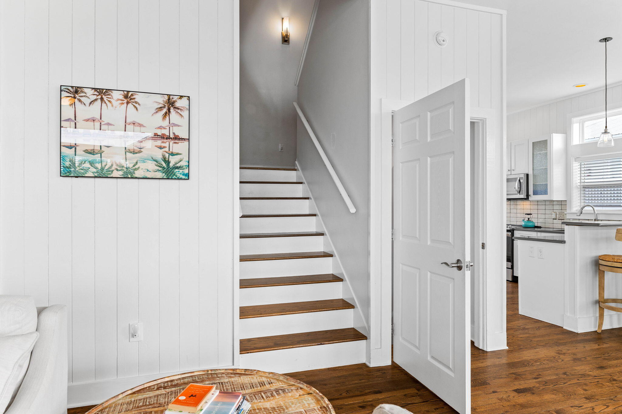 49 Sandy Lane Santa Rosa Beach, FL 32459 - Photo 24 of 73 a view of a hallway with wooden floor and dining room