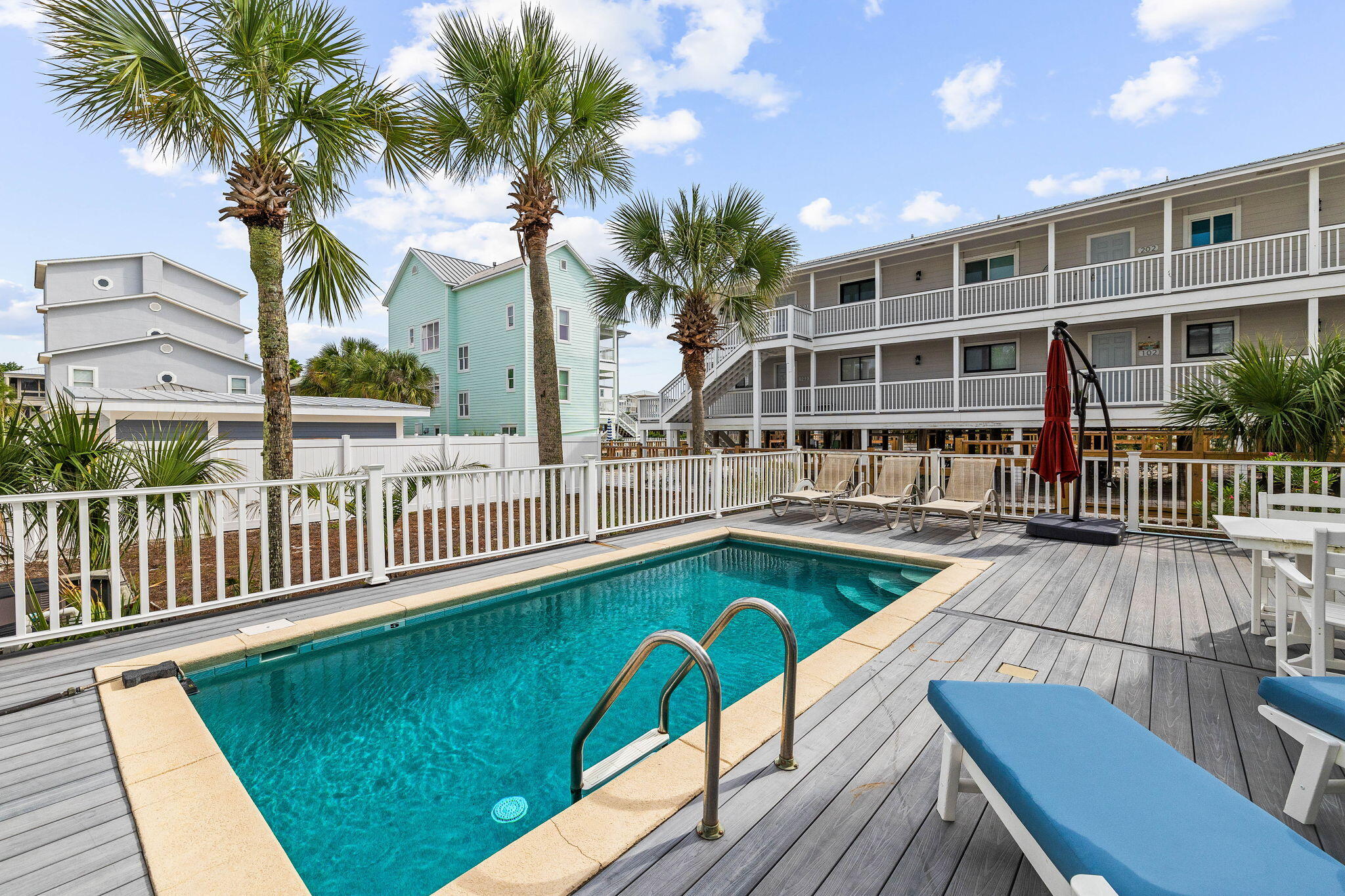 49 Sandy Lane Santa Rosa Beach, FL 32459 - Photo 51 of 73 a view of a swimming pool with a patio and a garden